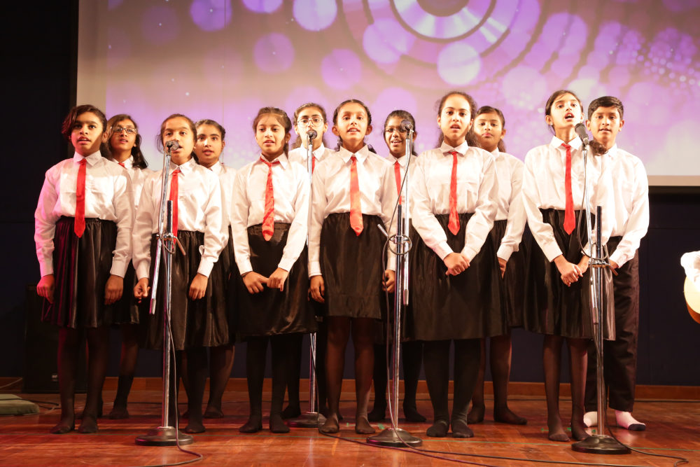 Kids Confidently Singing On Stage For Annual School Function